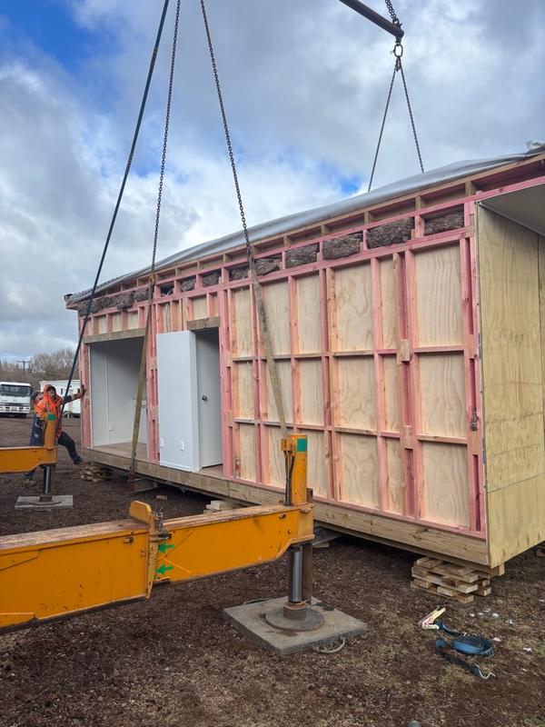 Kitchen side lifted for transport prep
